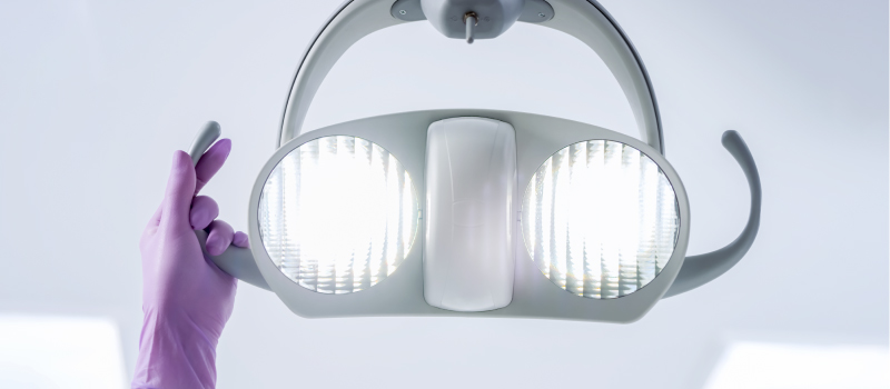 Closeup of a light over a dental chair for a post about advanced dental technology