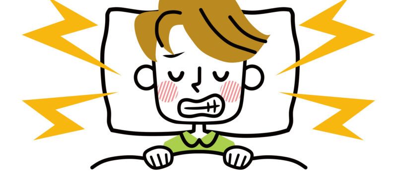 Illustration of a man struggling with teeth grinding as he sleeps